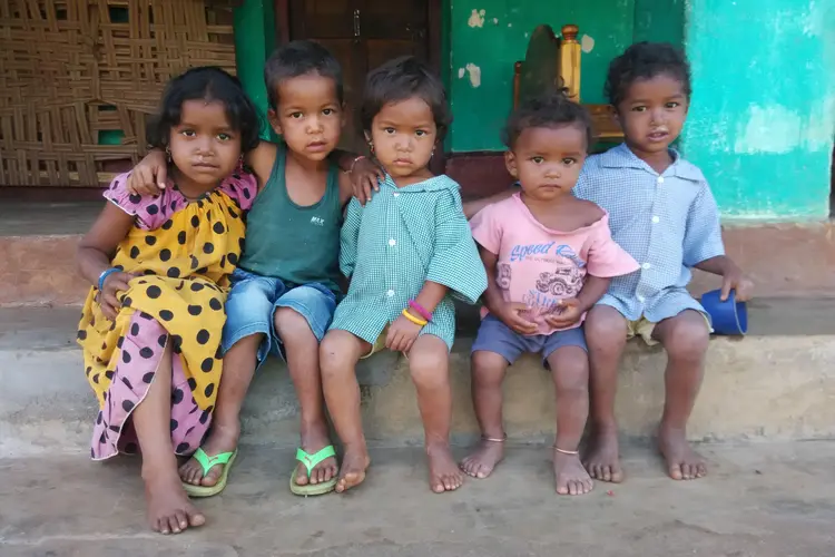 Young children sitting on a step