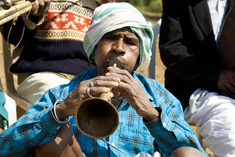 Man playing traditional trumpet