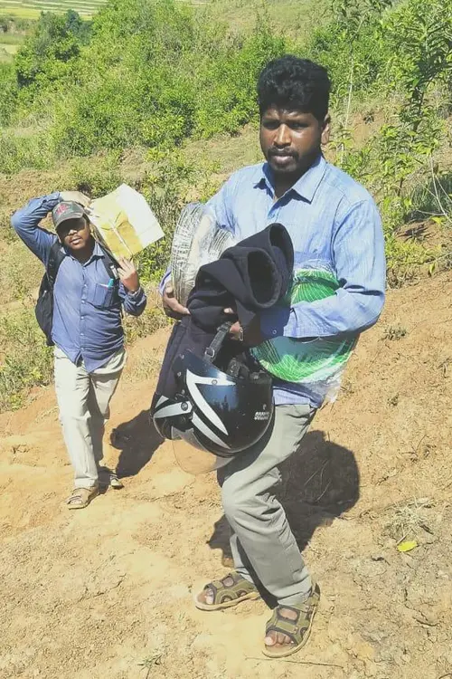 2 men walking up hillside