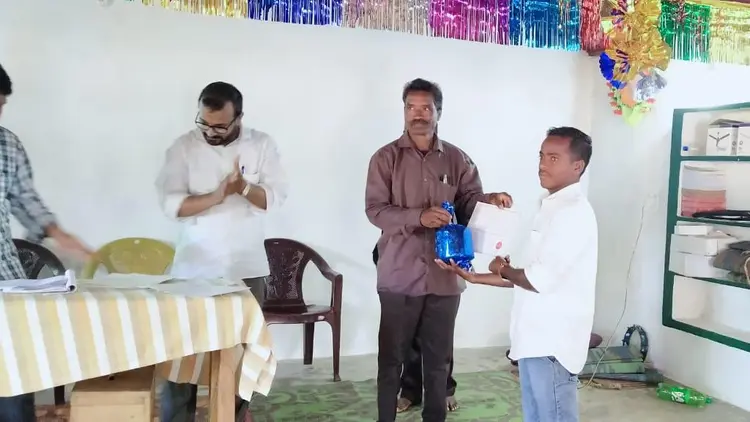man receiving a certificate in a public ceremony
